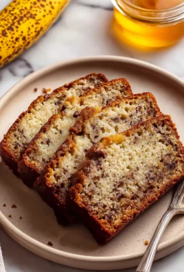 Loaf of moist cottage cheese banana bread on a wooden table