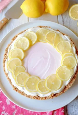 Pink Lemonade No-Bake Pie with colorful layers and whipped cream topping