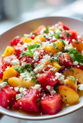 Refreshing watermelon peach salad with vibrant fruits in a bowl
