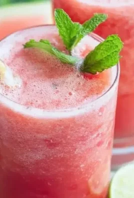 Refreshing Watermelon Mint Lime Slushies in a glass with mint leaves