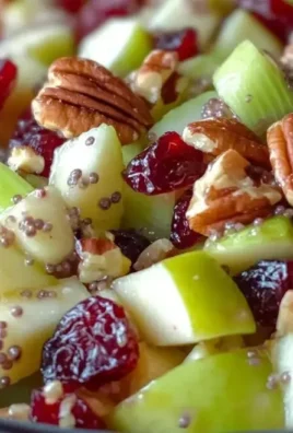 Fresh apple salad with greens, nuts, and a light dressing