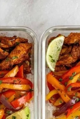 Colorful Chicken Fajita Meal Prep Bowls with vegetables and spices