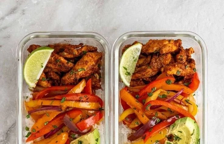 Colorful Chicken Fajita Meal Prep Bowls with vegetables and spices