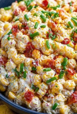 Delicious Crack Corn Salad with corn, peppers, and dressing served in a bowl.