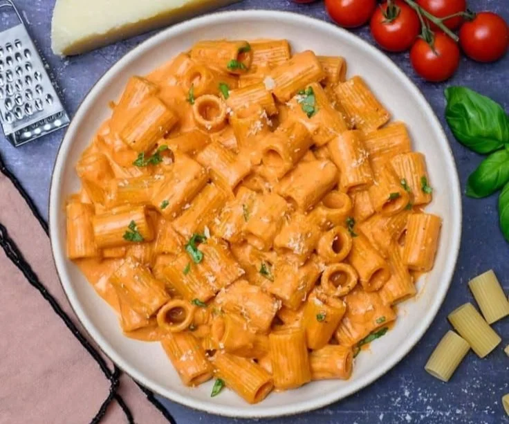 Delicious creamy tomato pasta sauce in a bowl ready to be served with pasta.