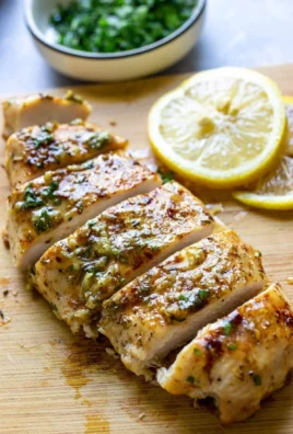 Garlic Butter Baked Chicken Breast served with herbs and spices