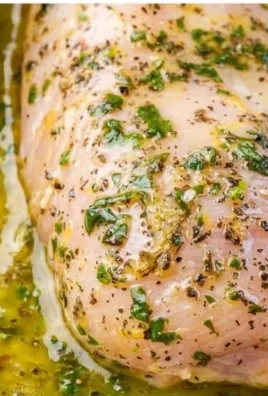 Greek baked chicken breast topped with feta cheese and herbs