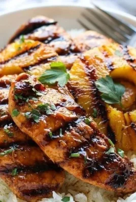 Delicious Hawaiian Chicken with pineapple and coconut rice on a plate