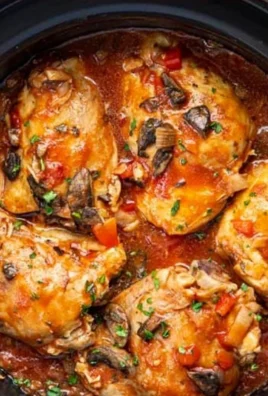 Delicious plate of Hunter's Chicken with flavorful sauce and herbs