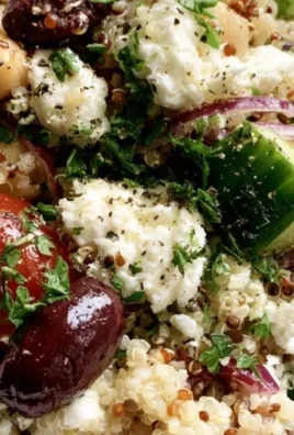 Mediterranean quinoa salad with fresh vegetables and herbs in a bowl