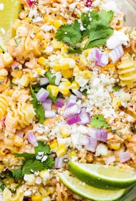 Bowl of Mexican street corn pasta salad with colorful ingredients