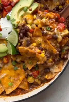 Delicious one-pan enchilada skillet filled with cheese, beans, and spices.
