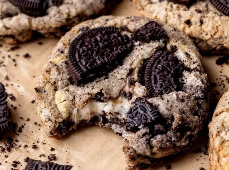 Plate of delicious Oreo Cheesecake Cookies with a creamy filling and Oreo pieces