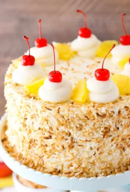 Delicious Pina Colada Layer Cake with coconut and pineapple layers