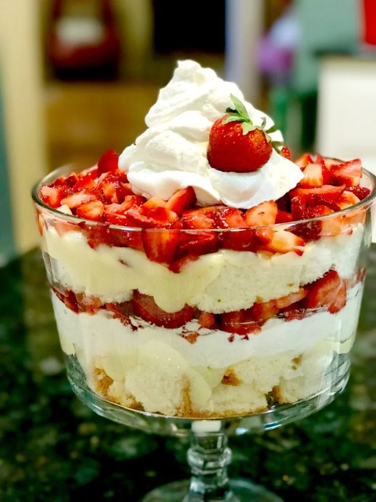 Layered Strawberry Shortcake Trifle with strawberries and whipped cream.