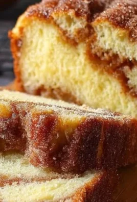 Freshly baked Cinnamon Sugar Bread with a golden crust and sweet topping.