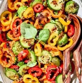 Viral TikTok cucumber and bell pepper salad in a bowl